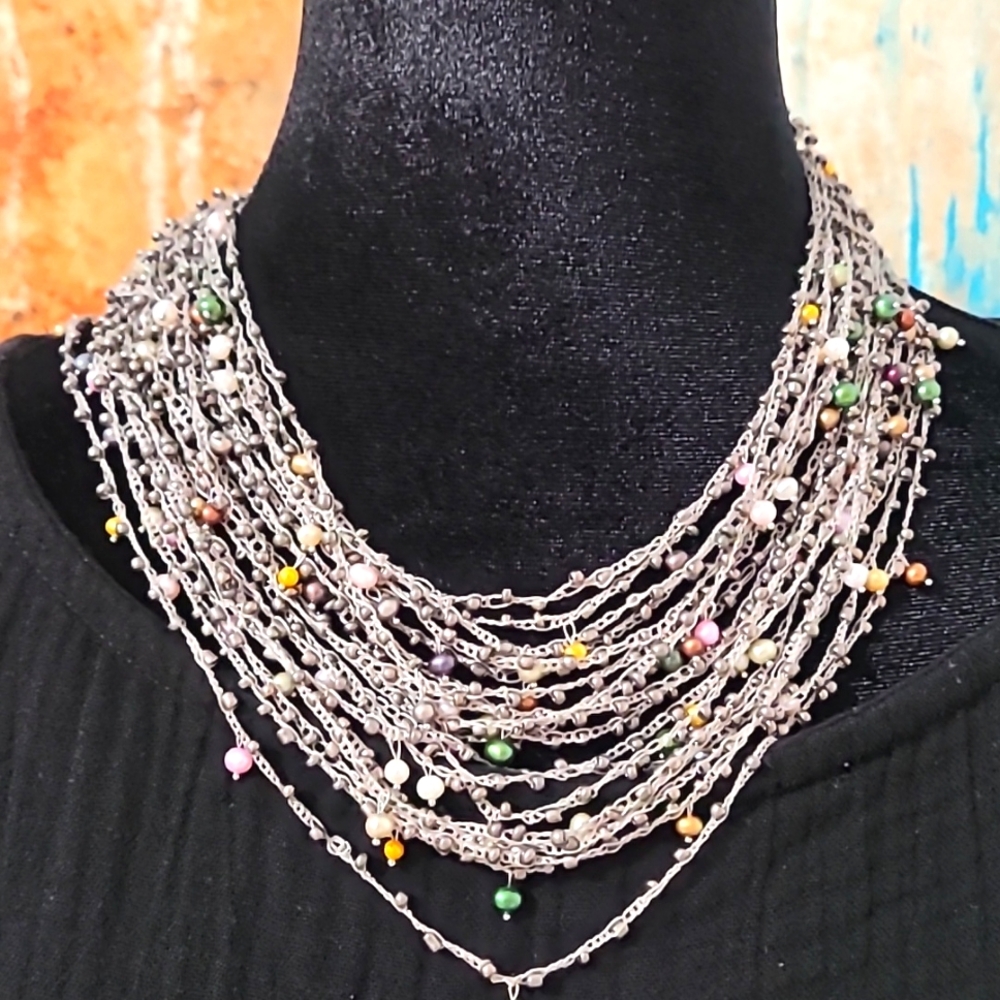 Crochet handmade pearl strung necklace.